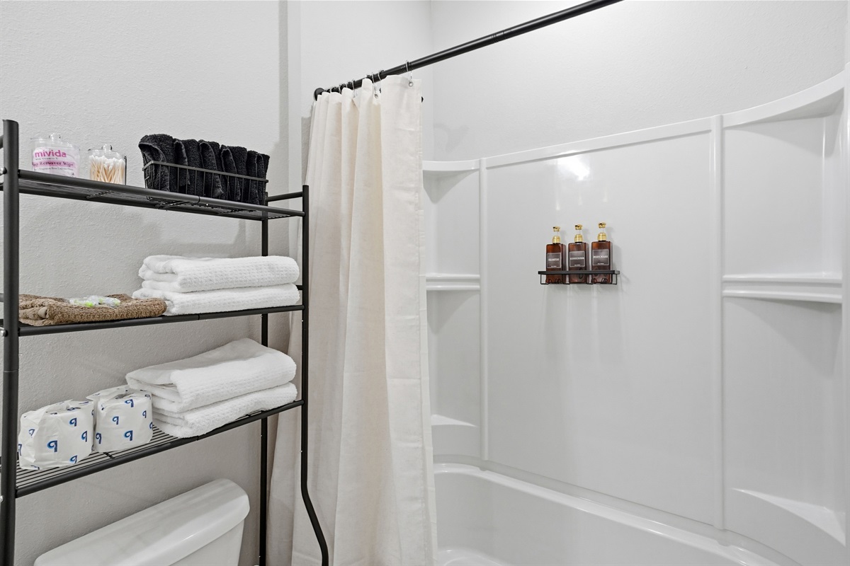 Guest bathroom with bathtub and single vanity