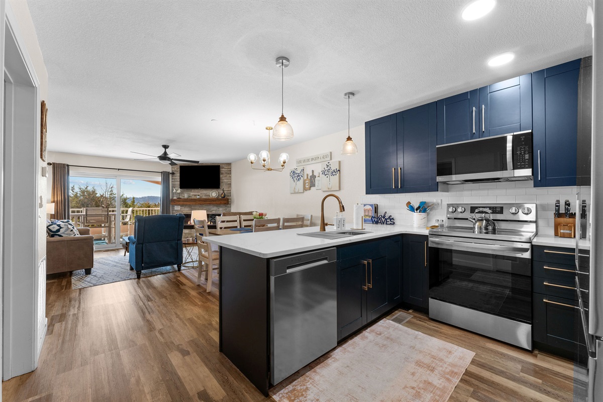 Fully updated kitchen with stainless appliances and quartz countertops.