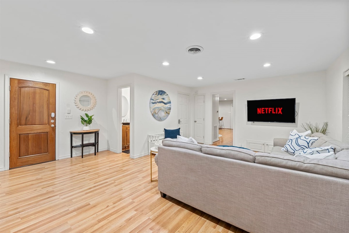 A half-bathroom sits directly near the living area with a console table for setting your things down after settling in!