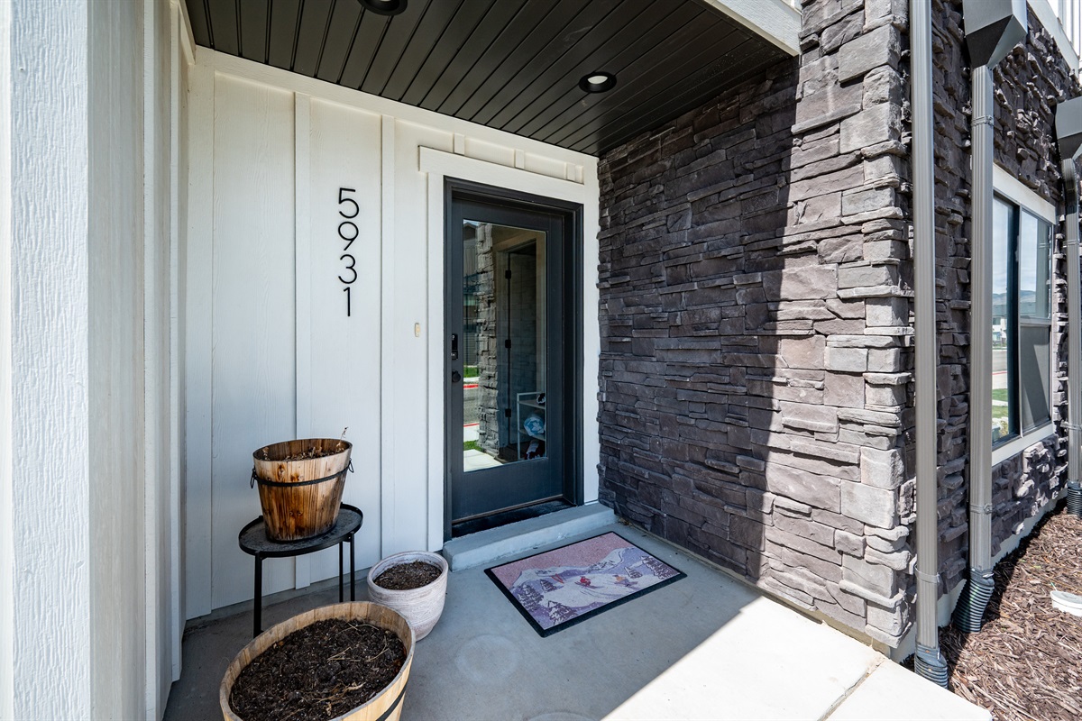 Welcoming front entry with modern mountain architecture.