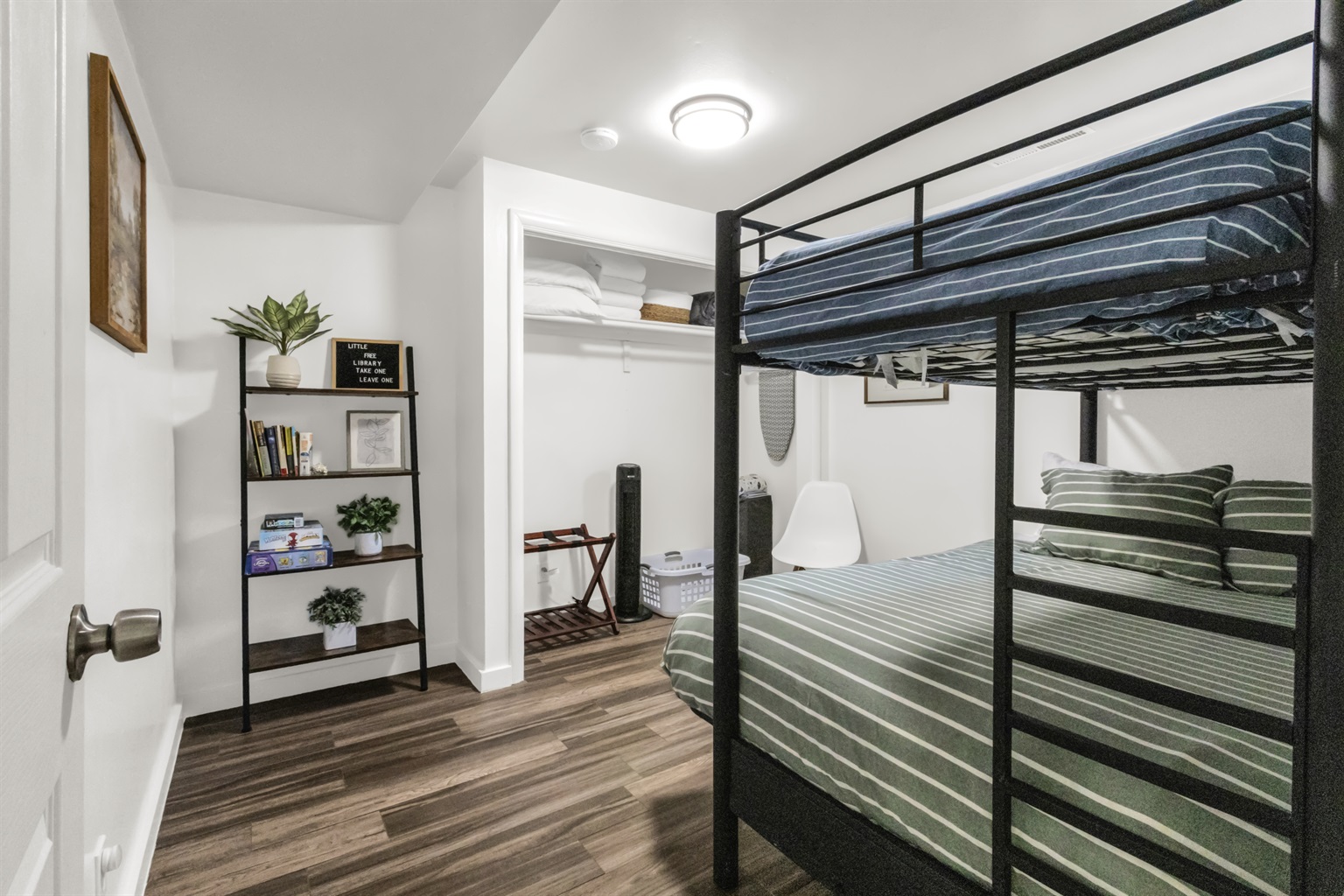 Bunk beds, closet, and decor in second bedroom