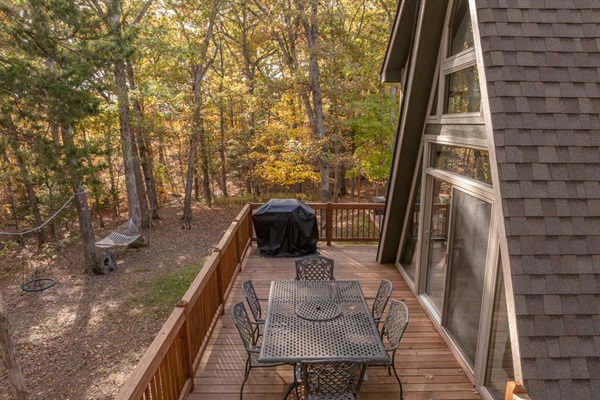 Outdoor seating and gas BBQ grill on our deck