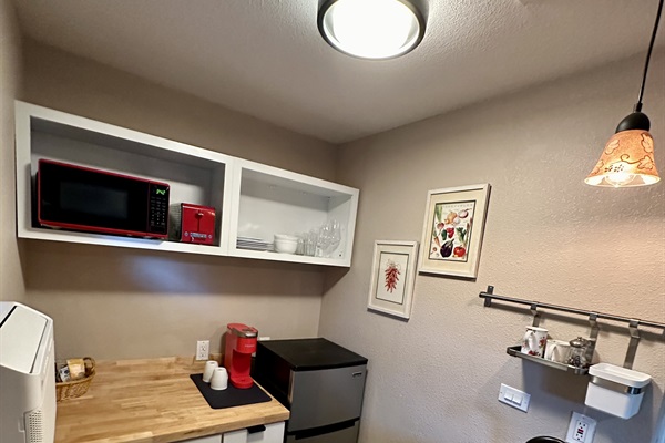 Peaceful bedroom corner w/ soft bedding & a warm glow