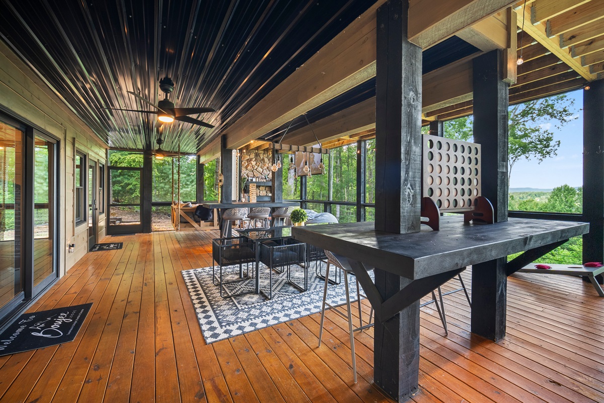 Besides, the spacious deck area offers the perfect blend of outdoor games, casual seating, and stunning views.