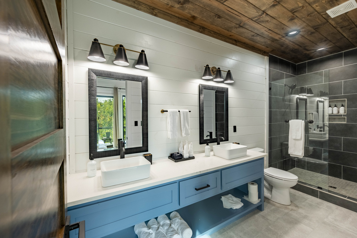 Enjoy spa-like experience in our modern bathroom featuring a spacious double vanity, stylish finishes and thoughtful amenities for your comfort and convenience
