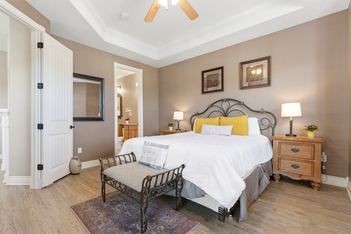 Relax in our comfortable master bedroom with a king-size bed and a private ensuite bathroom for added convenience.
