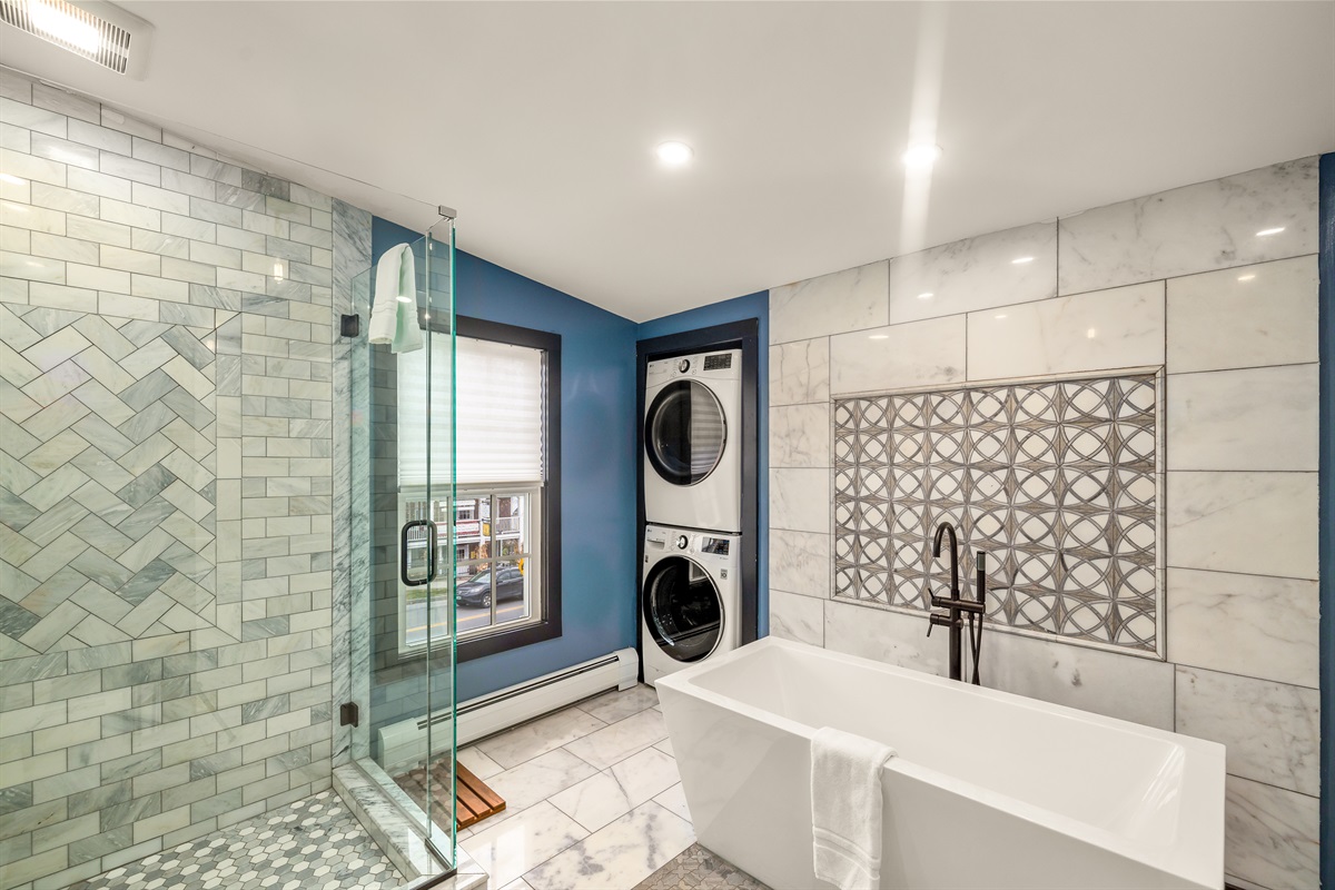 Main floor bathroom with laundry and tub