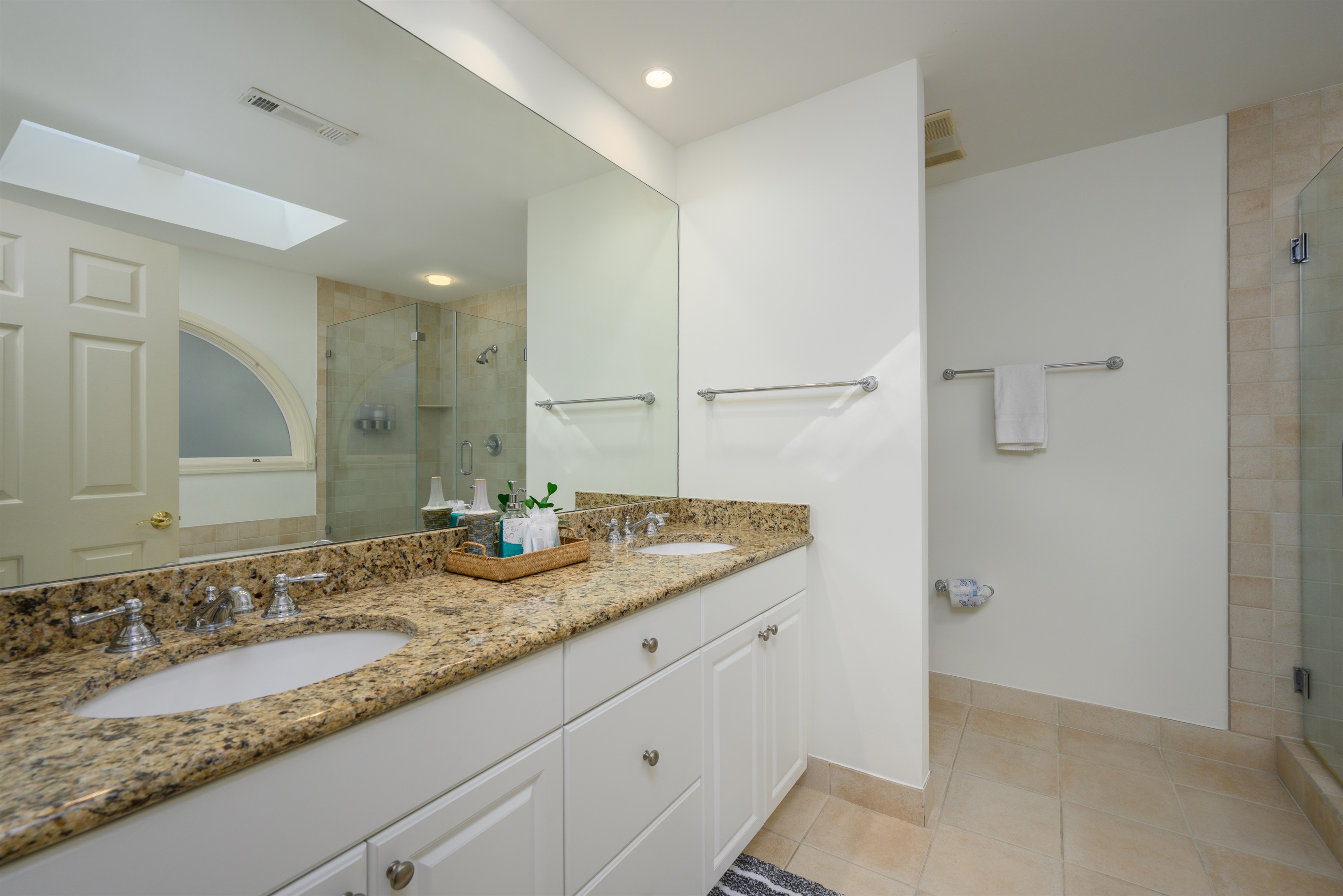 Double Queen Bathroom features dual sinks and walk-in shower