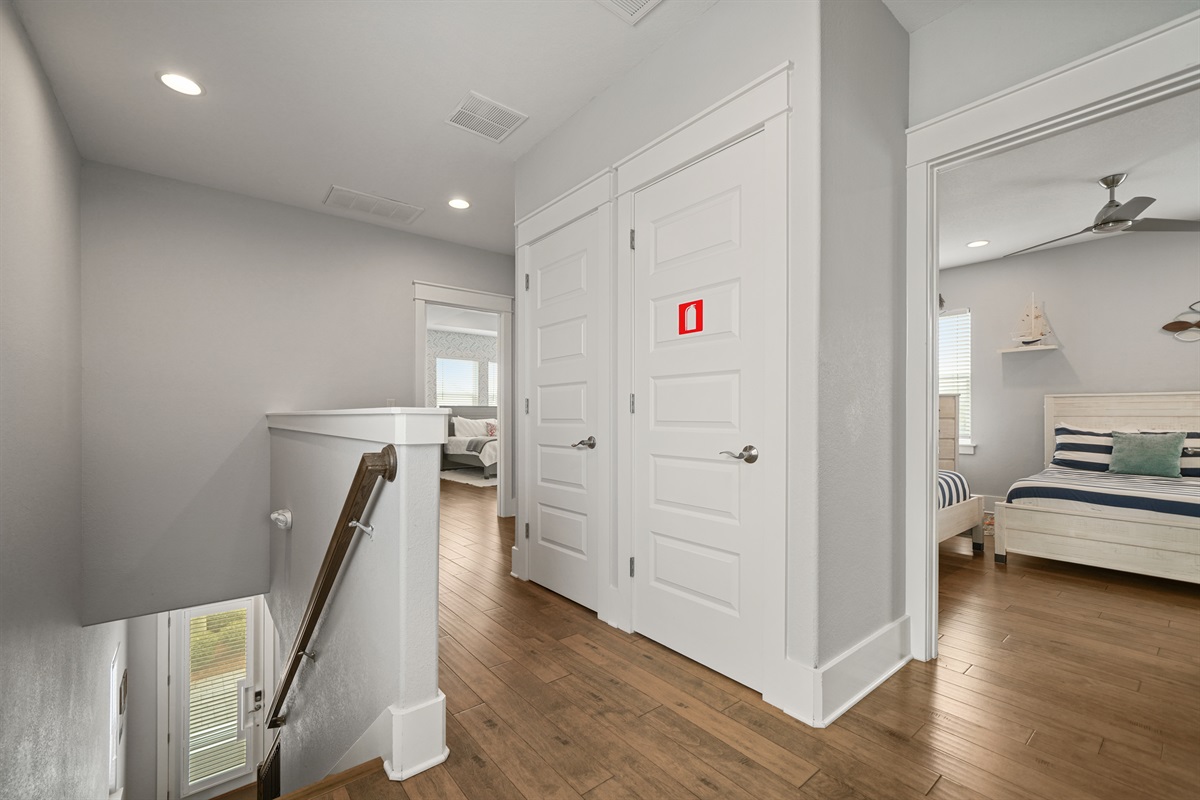 Upstairs hallway providing easy access to bedrooms and living spaces.