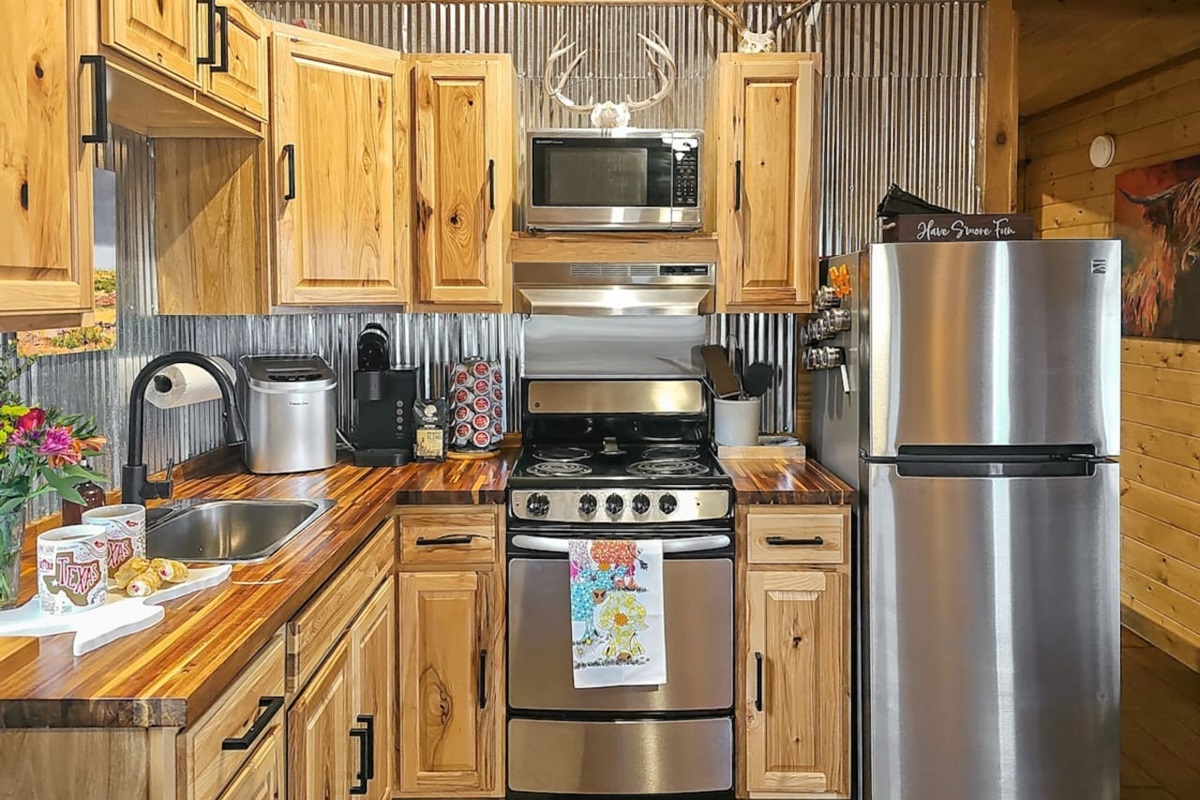Fully equipped and ready for your culinary adventures, this kitchen combines rustic charm with all the modern amenities you need for a comfortable stay in the Hill Country.