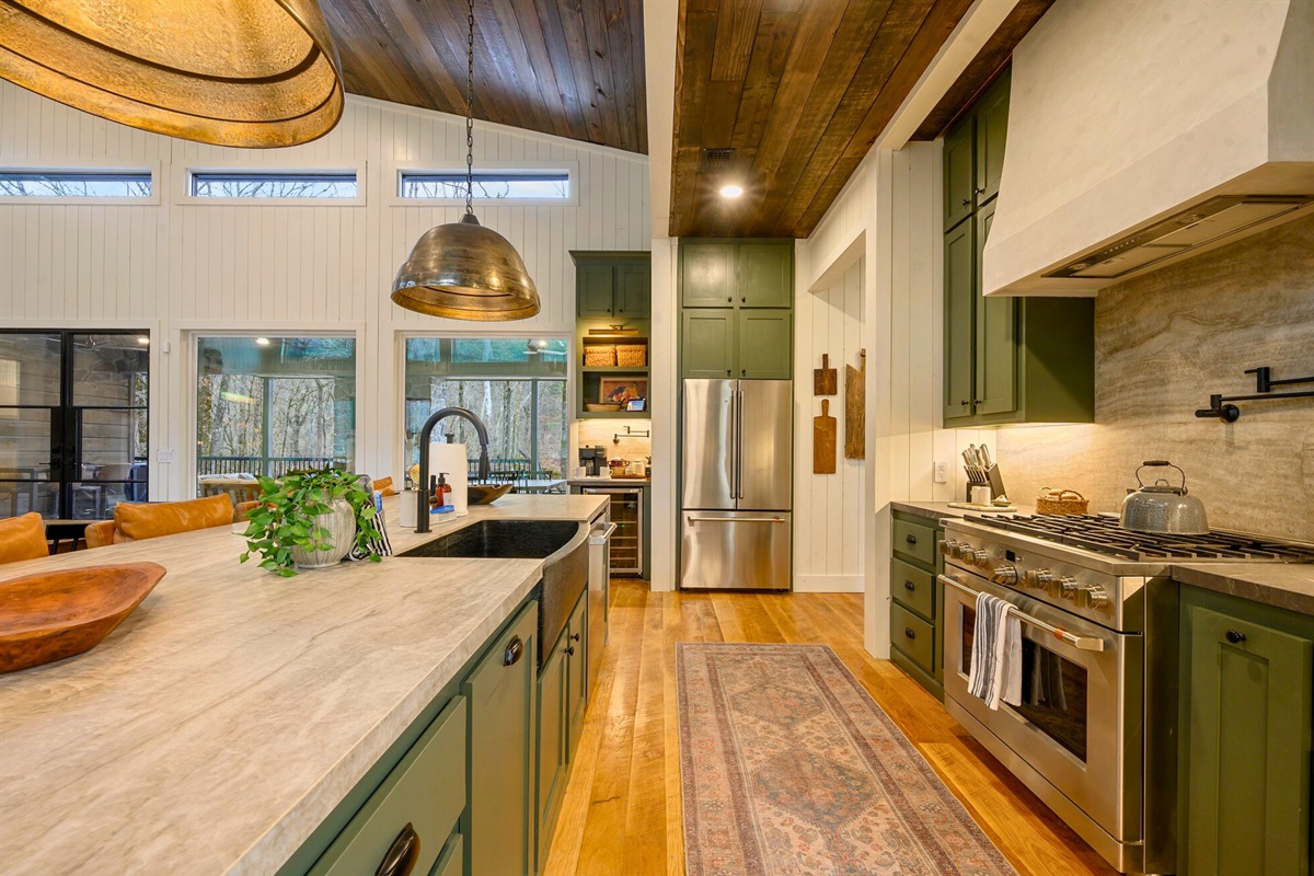 Another angle gives you a peek at the spacious counters and warm finishes that make cooking feel effortless here.