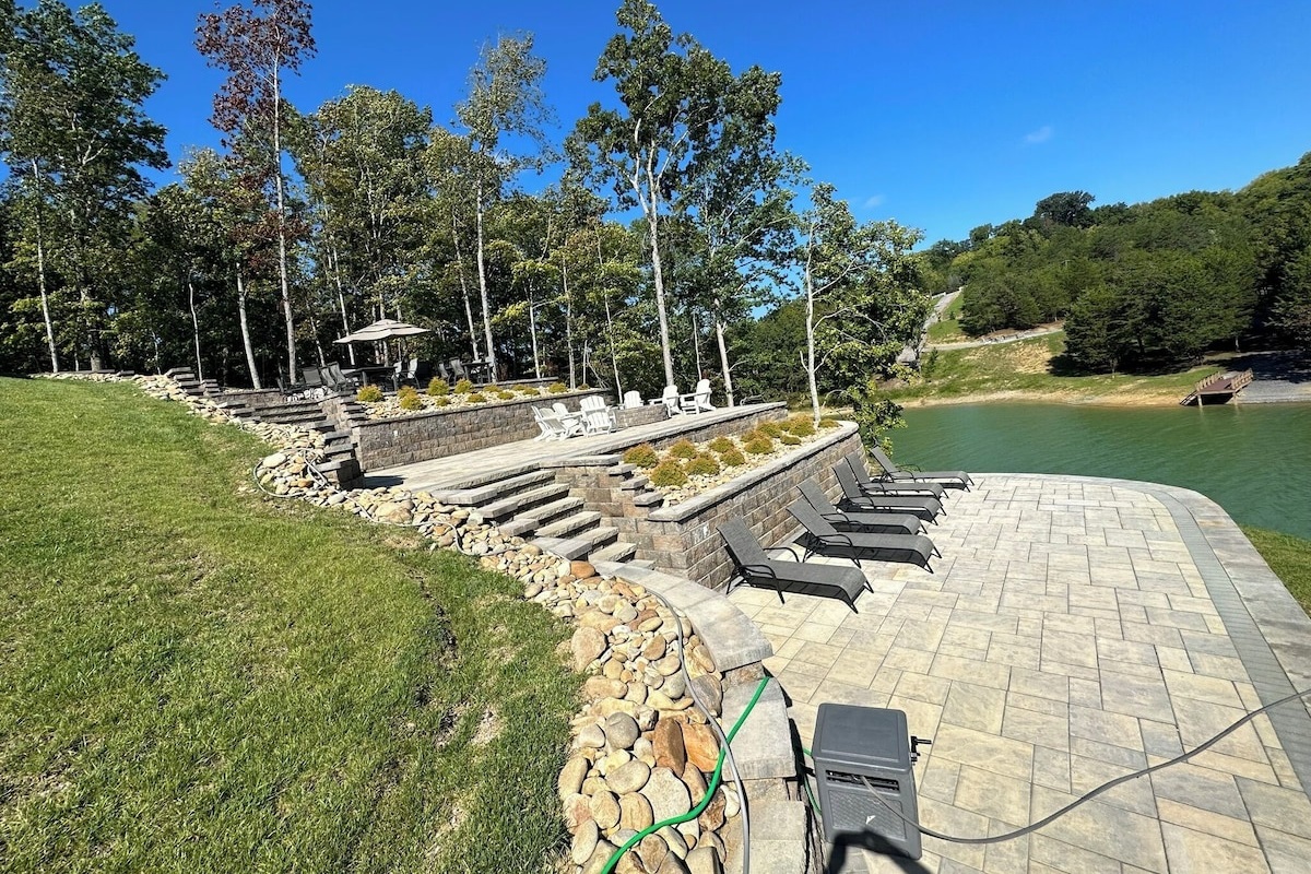 Bottom Patio with lots of lounge chairs and water on 2 sides