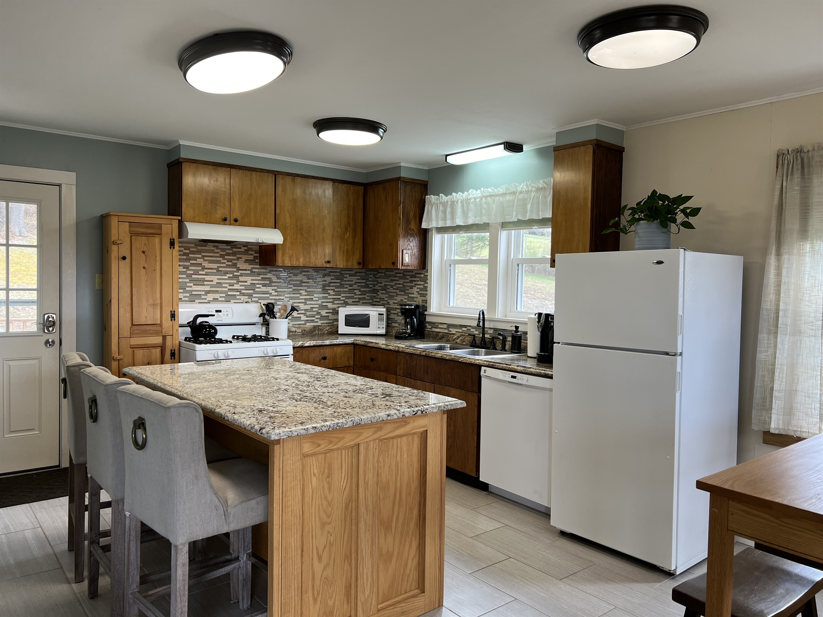 Comfy chairs at the kitchen island.