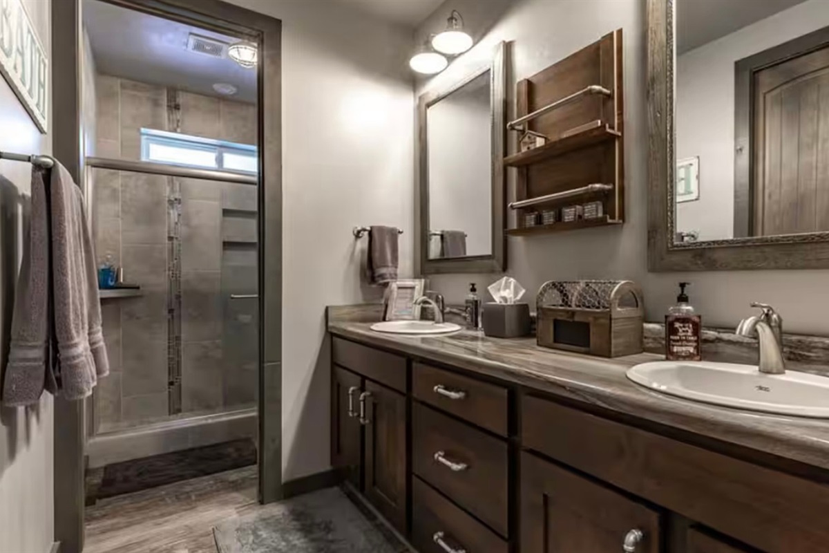 Large bathroom with double sinks and plenty of counter space.