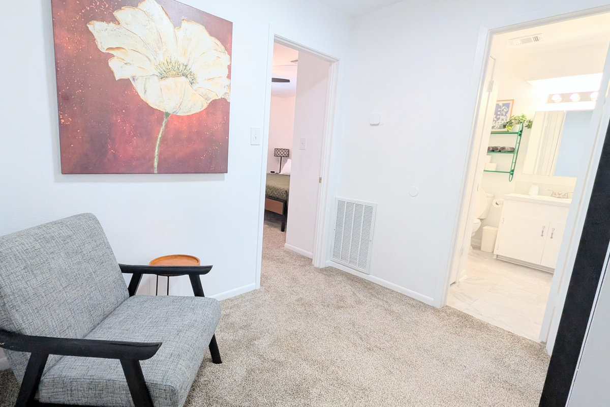 Located at the top of the stairs, this landing is a cozy place to relax with a book or scroll on your device. 