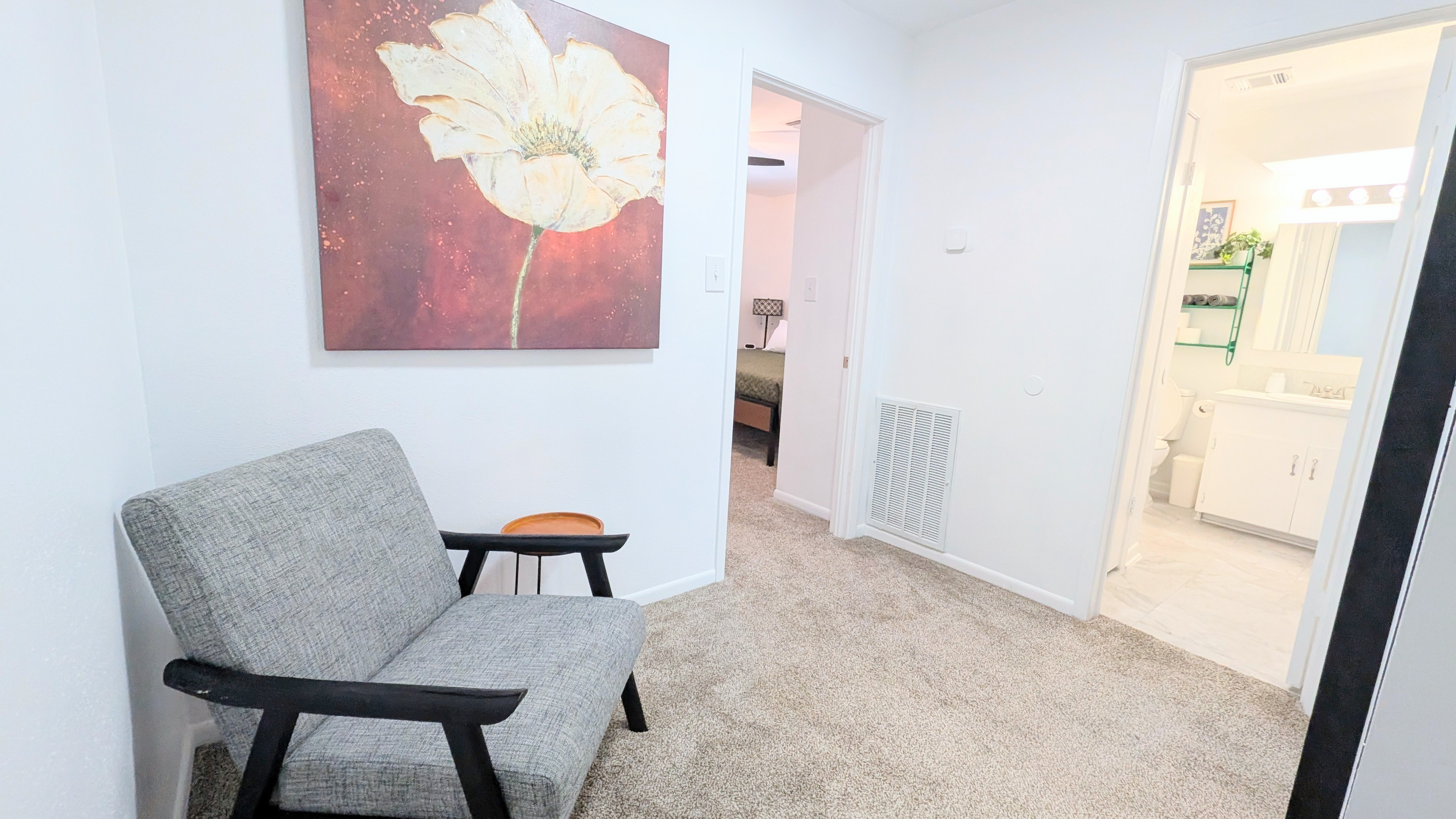 Located at the top of the stairs, this landing is a cozy place to relax with a book or scroll on your device. 