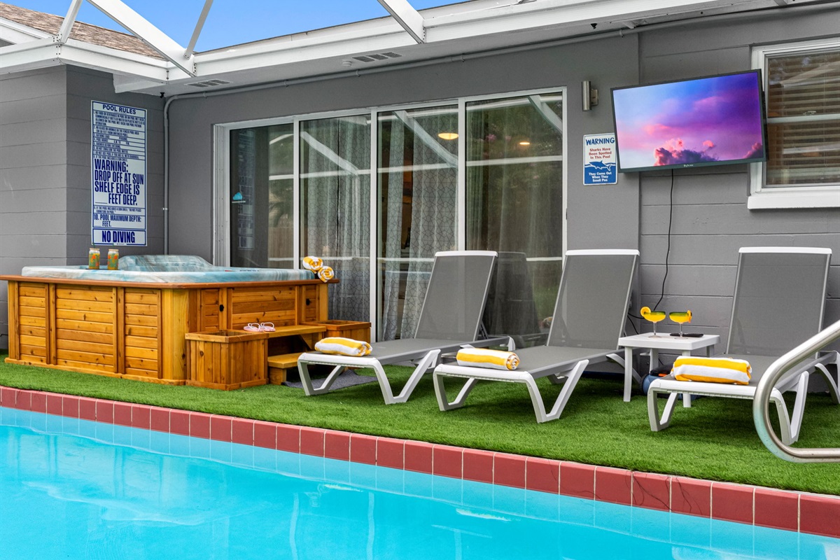 Kick back on a cushioned lounger, cocktail in hand, and soak in the sun by the sparkling screened-in pool.