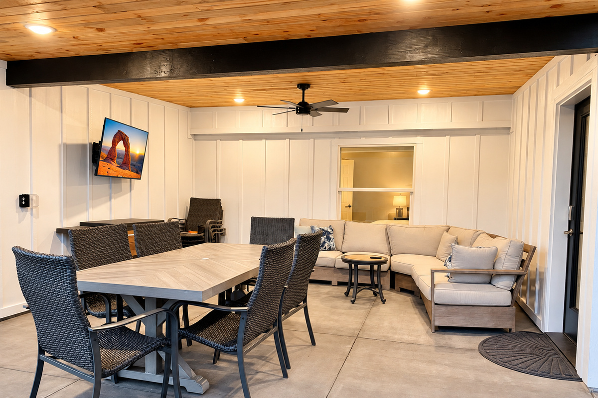Covered outdoor living space with TV