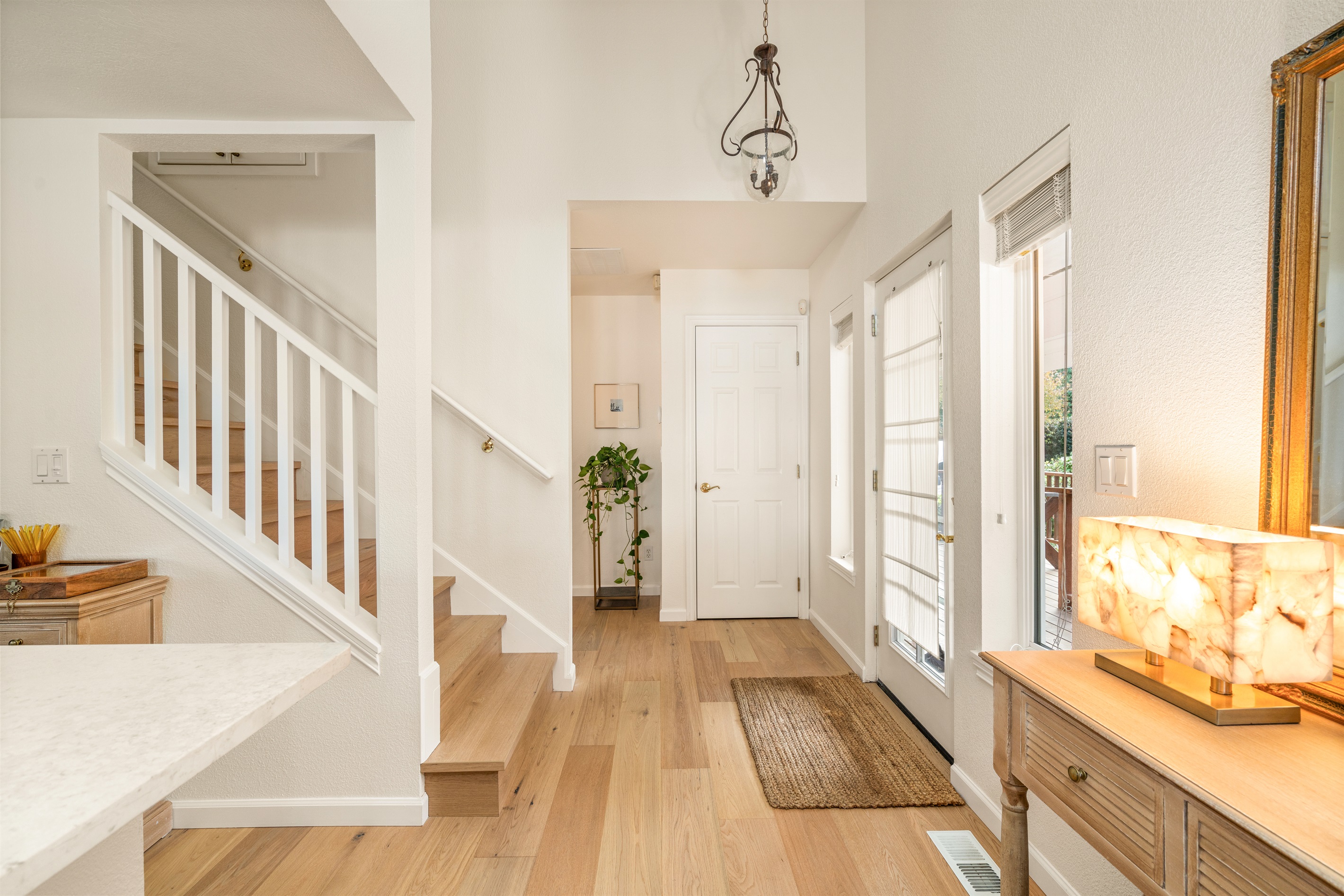 Welcome! front entry - inside. Beautiful white oak hardwood floors throughout. Open and bright layout!