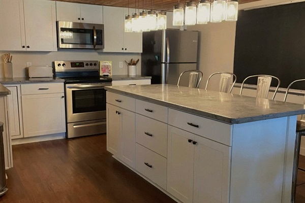 Large island perfect for meals, coffee, or gathering