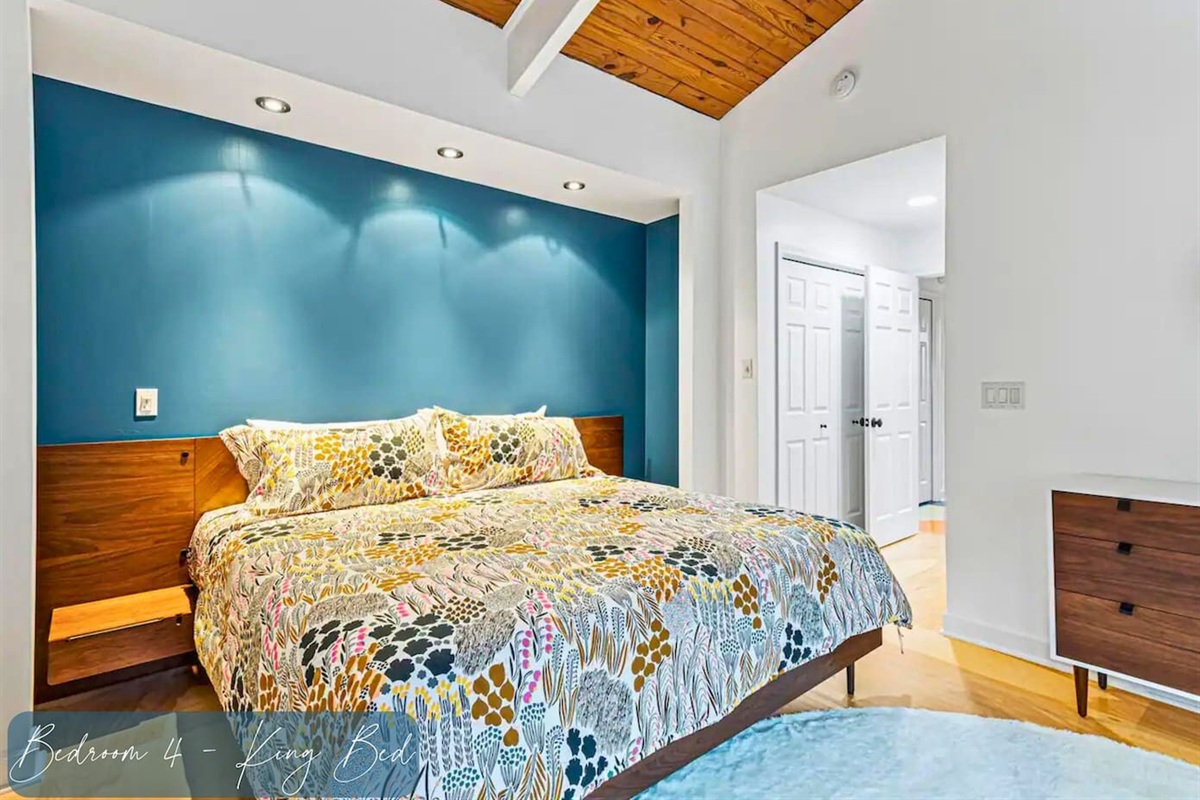 Luxurious King Size Bed in the Upstairs Bedroom with Vaulted Ceiling