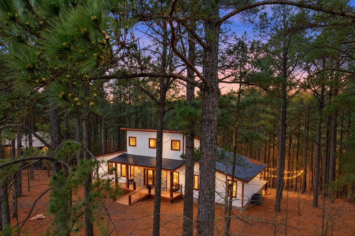 Escape into the pines, where warm windows welcome you home.
