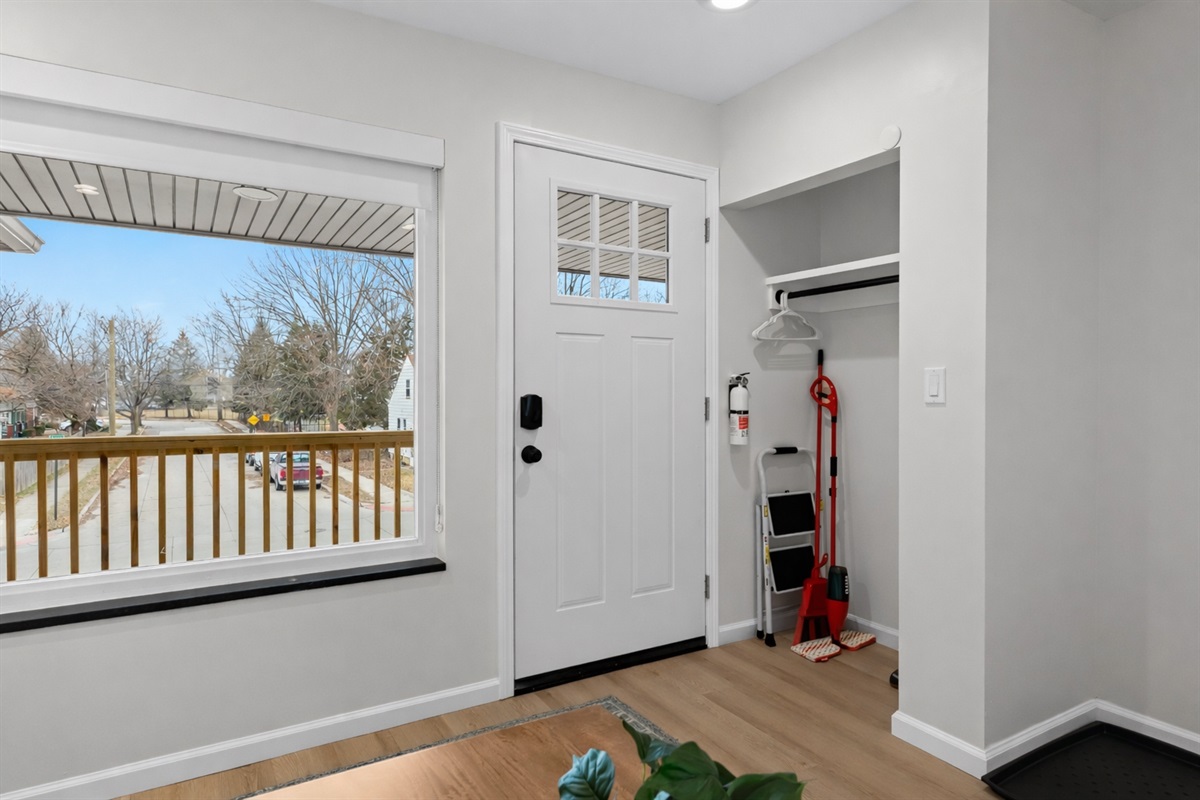 Bright entryway with a private entrance, large window, and convenient storage—welcoming, secure, and easy to settle into from the moment you arrive.