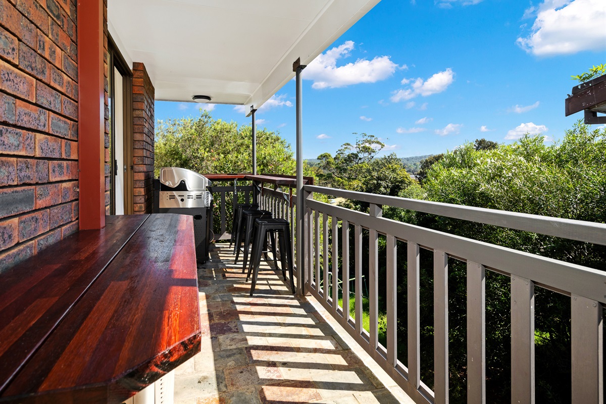 The BBQ balcony gives Bertie’s 3 Beaches a relaxed upper-level outdoor space, with room to cook and sit outside.