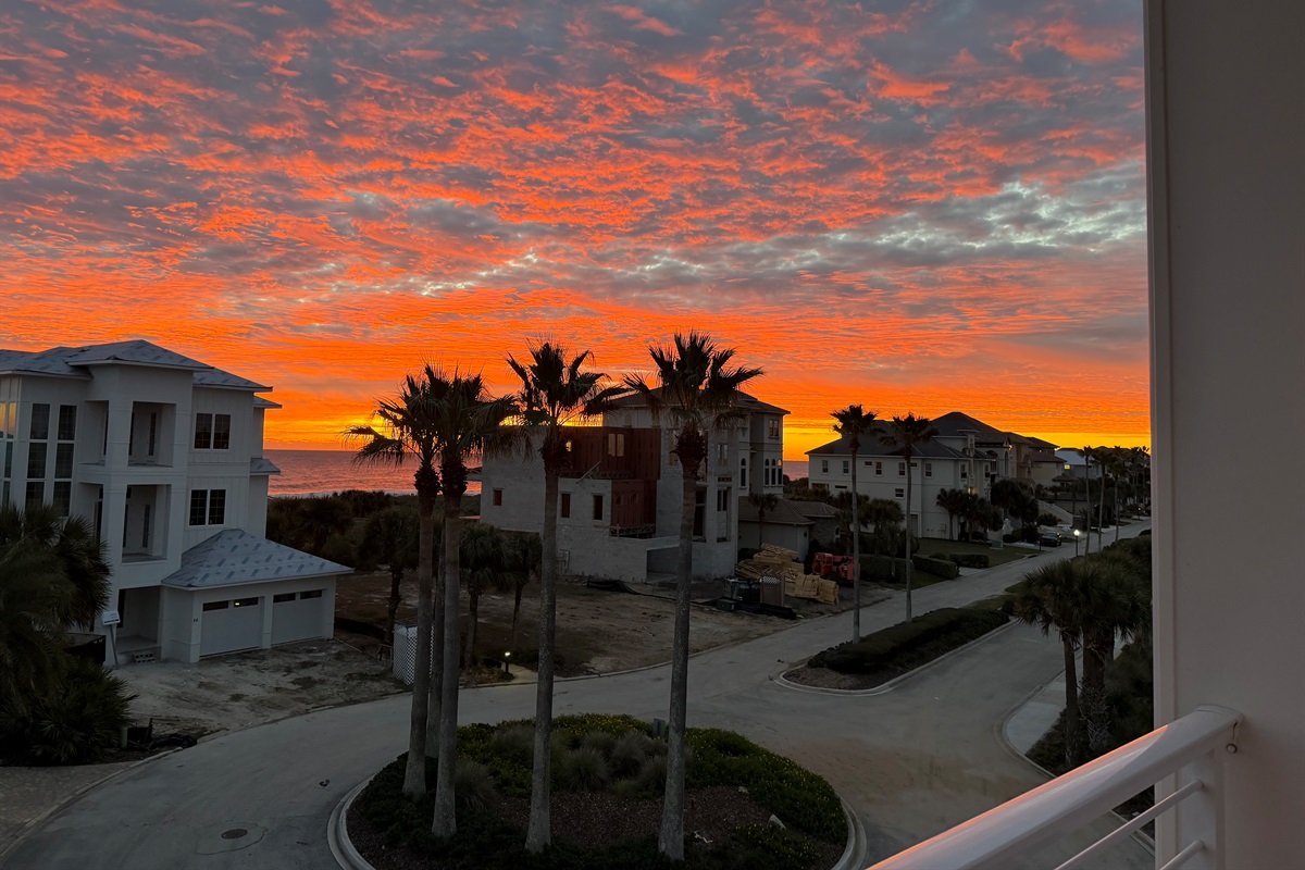 One more chapter before bed: the kids wrapped in blankets, everyone quiet on the balcony, watching the sky turn fire-orange over the ocean. These are the moments that make a family trip feel unforgettable.
