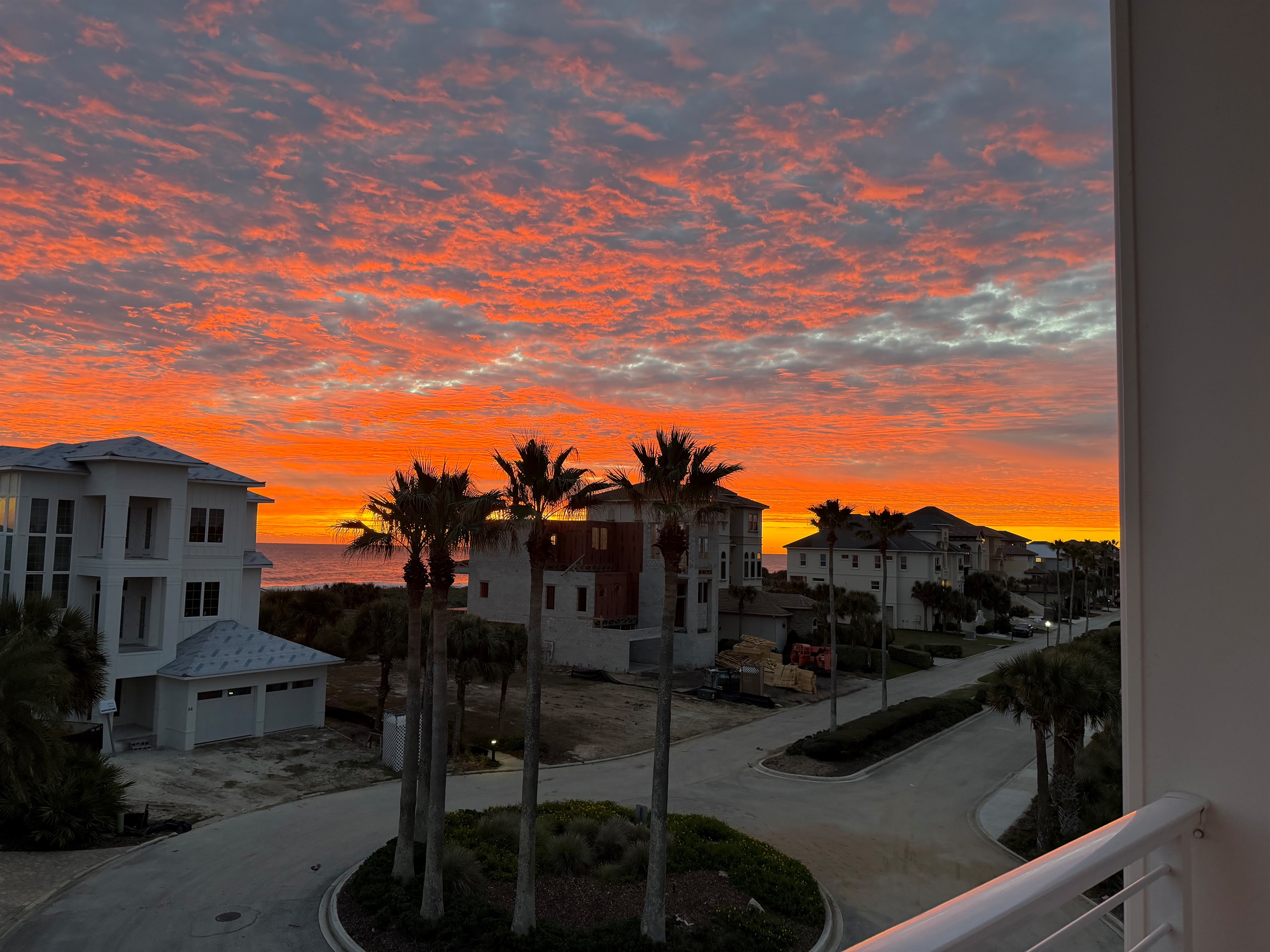 One more chapter before bed: the kids wrapped in blankets, everyone quiet on the balcony, watching the sky turn fire-orange over the ocean. These are the moments that make a family trip feel unforgettable.
