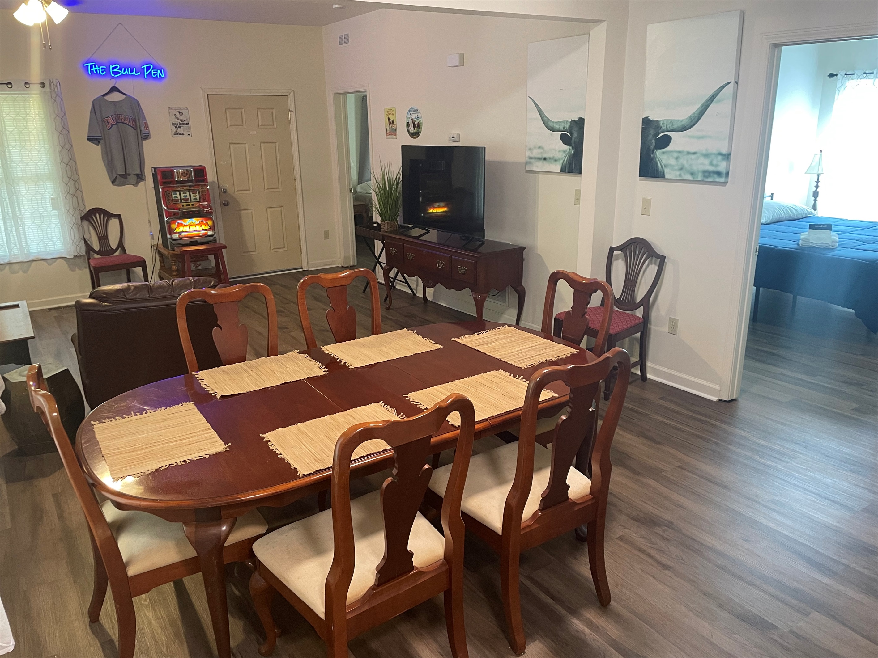 Open concept living dining area has plenty of space for 6 guests to relax and enjoy meals in or a card game around the table with friends. 
