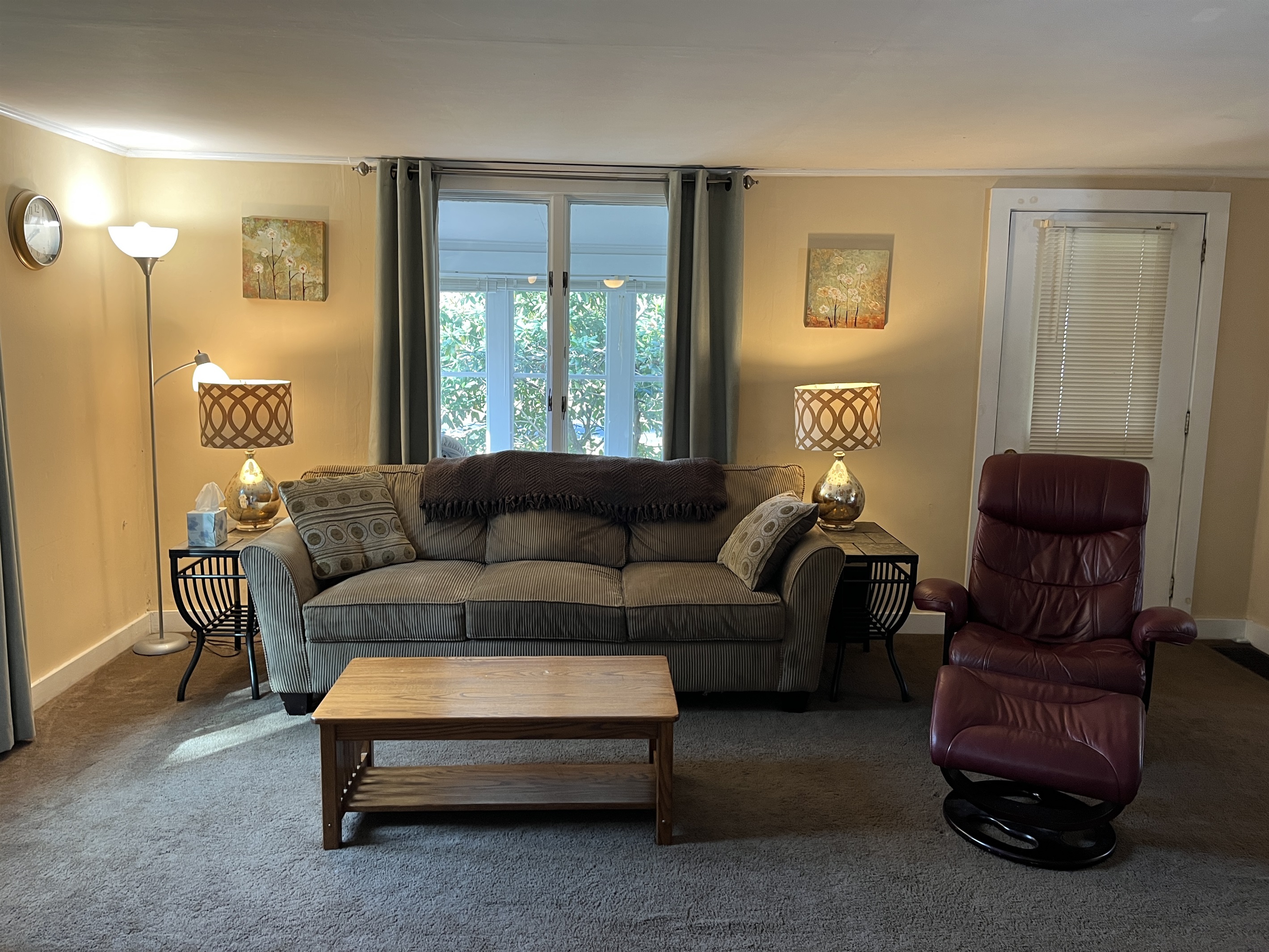 Living room and sunroom beyond