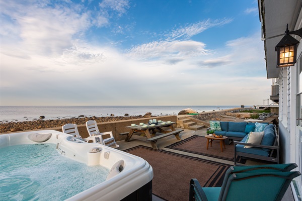 Experience nature's beauty from our cozy outdoor sitting area as you soak in the hot tub amidst the sights and sounds of the beach.