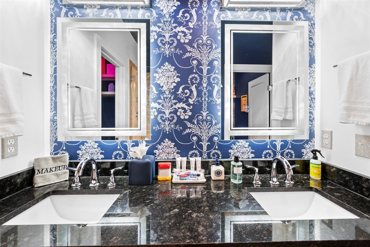 Double Vanity with pull down faucets and lighted led mirrors. 