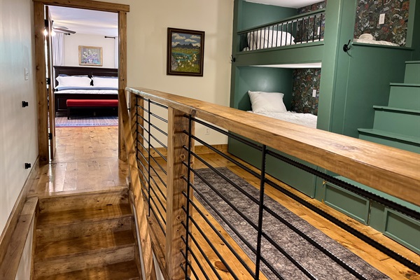 4th bedroom loft has cozy bunks with separate reading lights and wall outlets