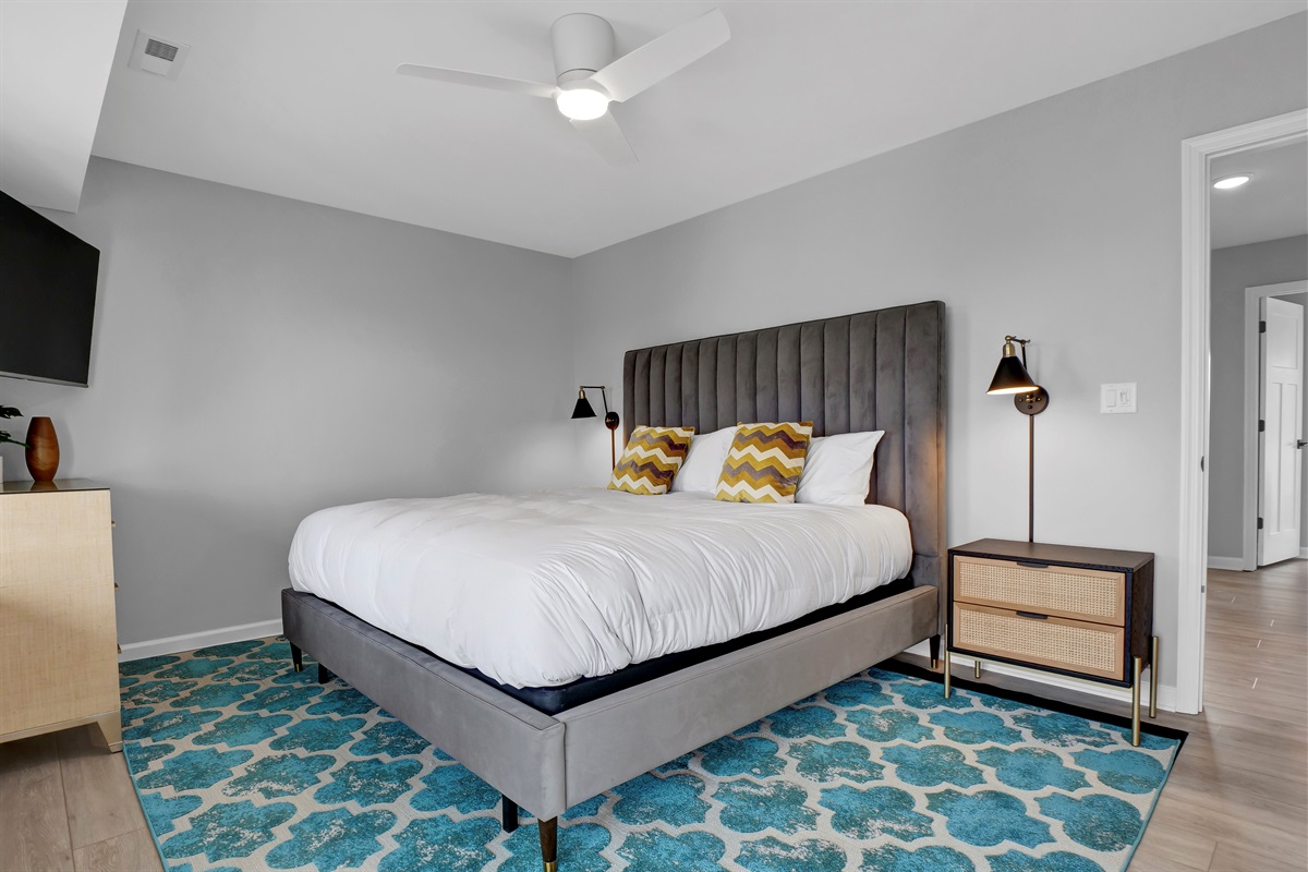 Relax in this stylish king bedroom featuring contemporary décor and a luxurious en-suite bathroom and private balcony