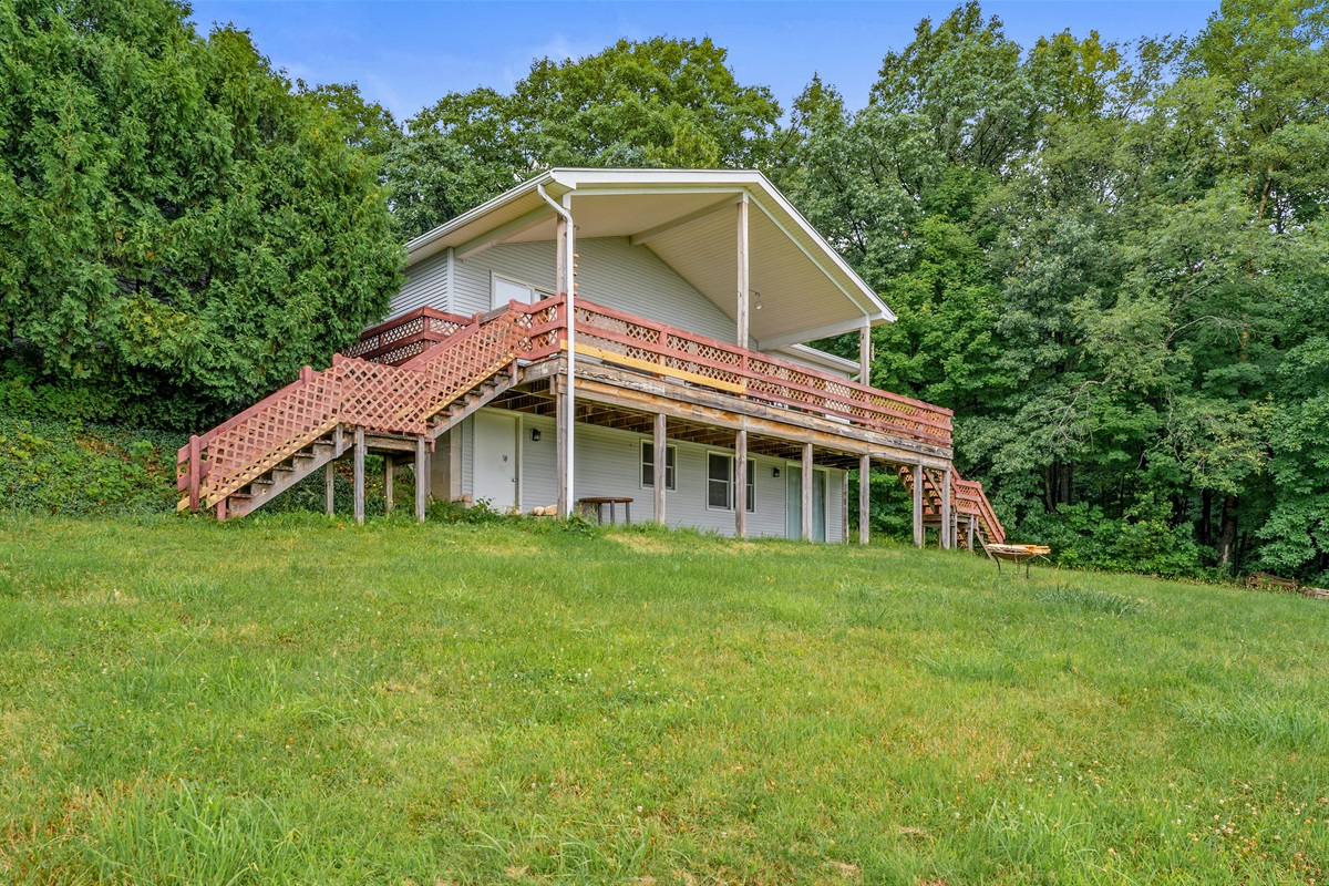Surrounded by mature trees, the elevated deck is perfect for sipping morning coffee or stargazing at night