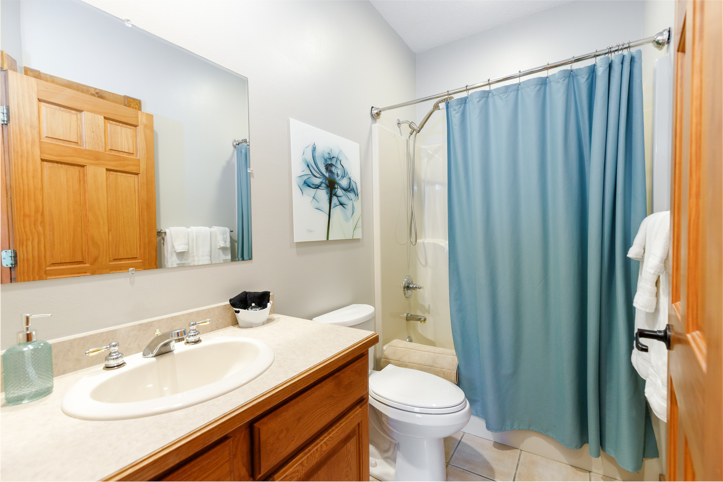 Bathroom on main level -- located directly off of Bedroom 2 and accessible from the main living area. 