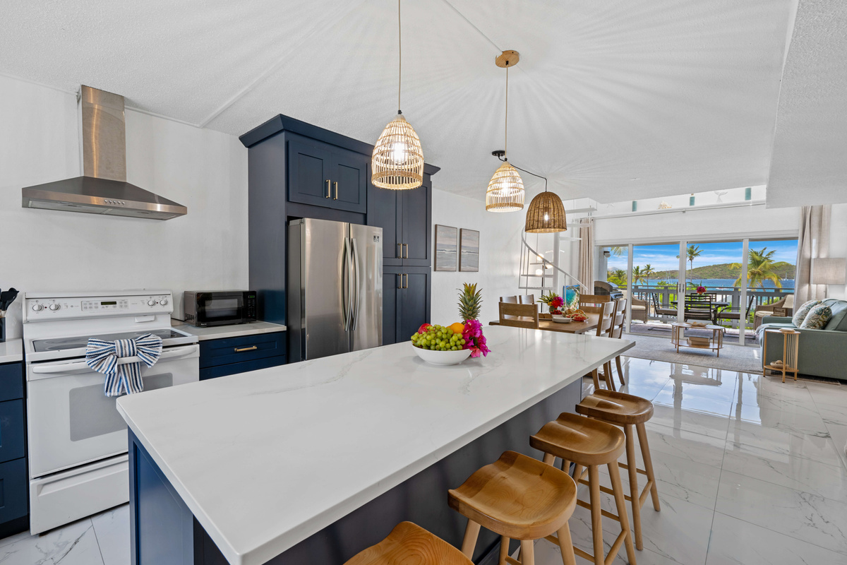 Island-inspired kitchen featuring modern appliances and ample workspace.