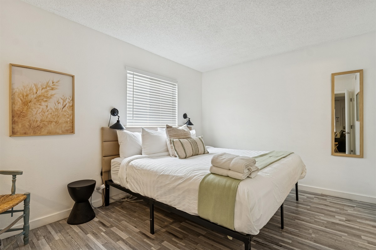 Another view of the comfortable king bed in the bedroom.