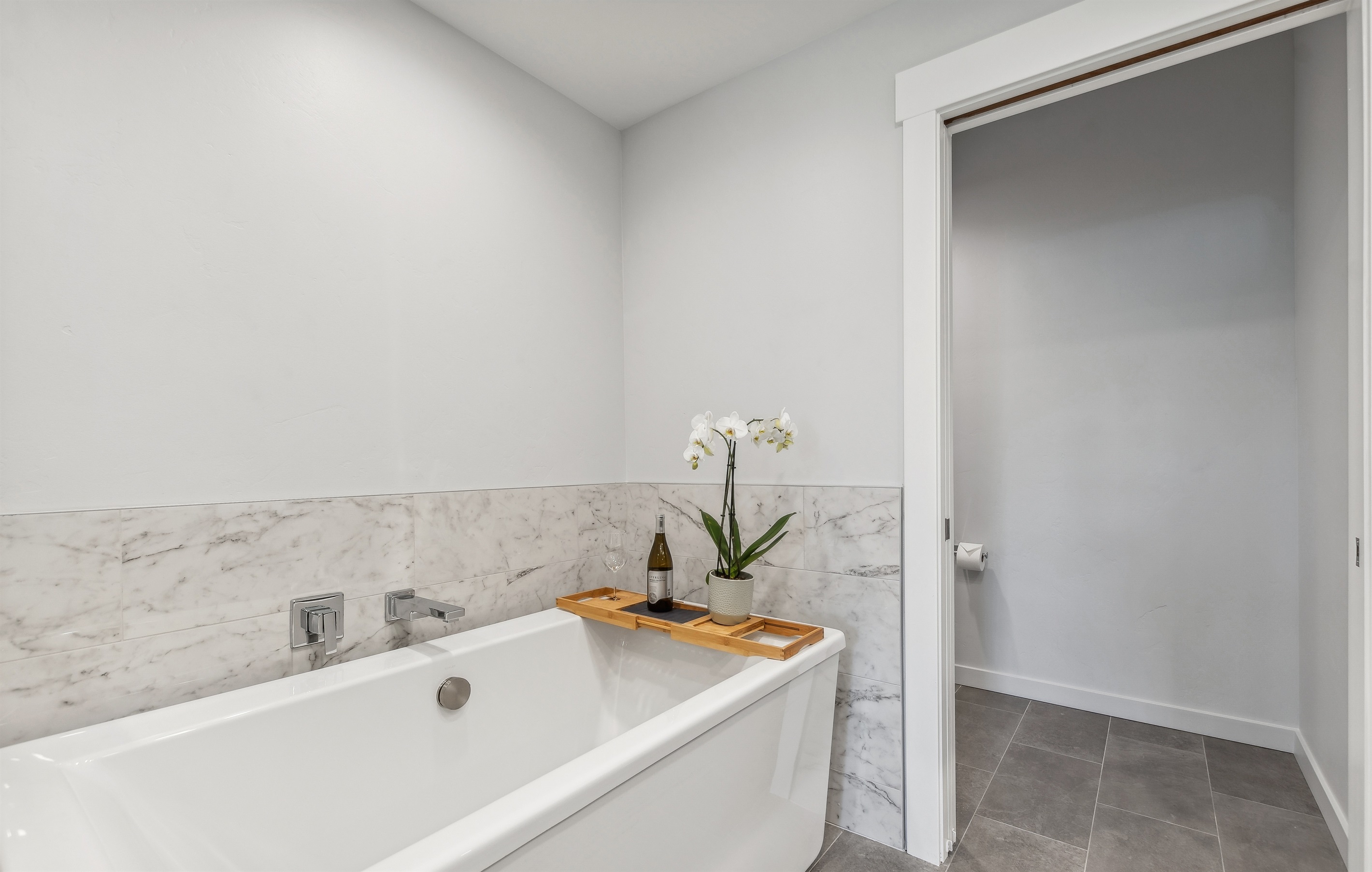 Enjoy a book or a glass of wine in the soaker tub