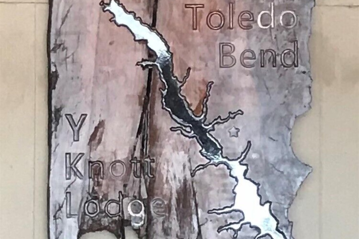 YKnott Lodge sign in living room made from "sinker maple" from Toledo Bend
