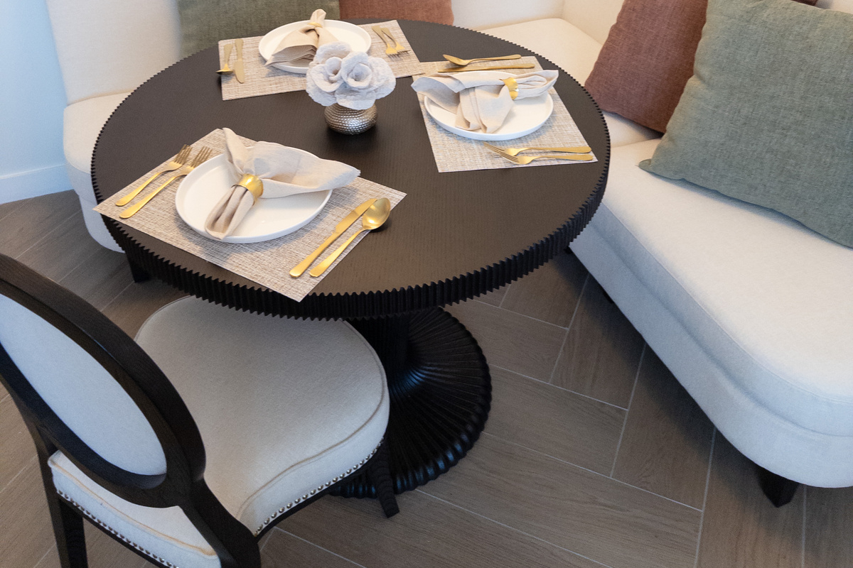 Dining for two - a marble bistro table set and ready in the den.