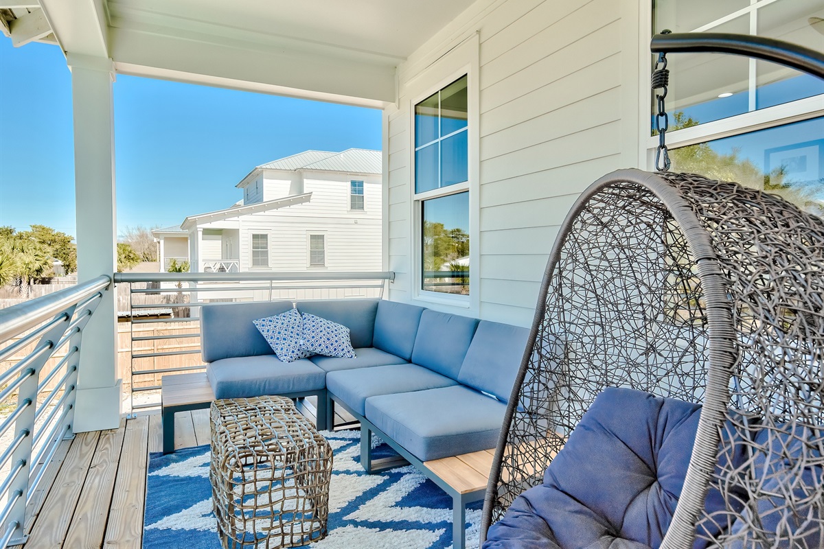 Multiple balconies outfitted with sleek, comfortable furniture
