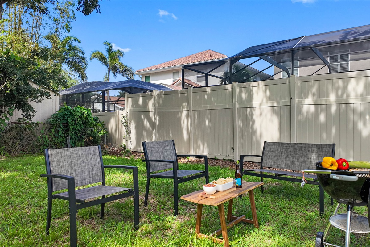 Surrounded by a clean and modern horizontal wood plank fence, this backyard offers peace of mind and a sense of seclusion.