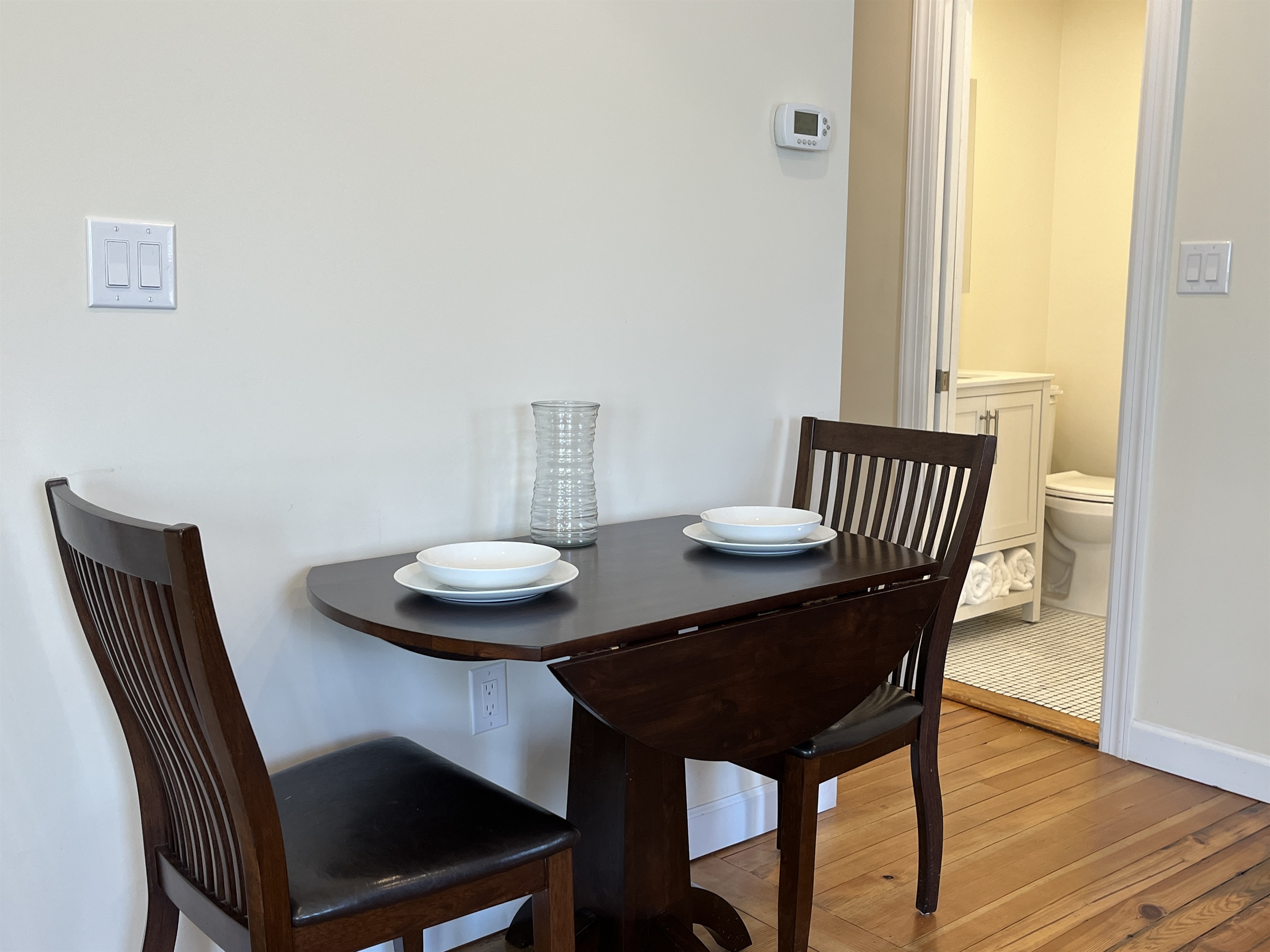 Dining area with laundry, full bath and bedroom around the corner