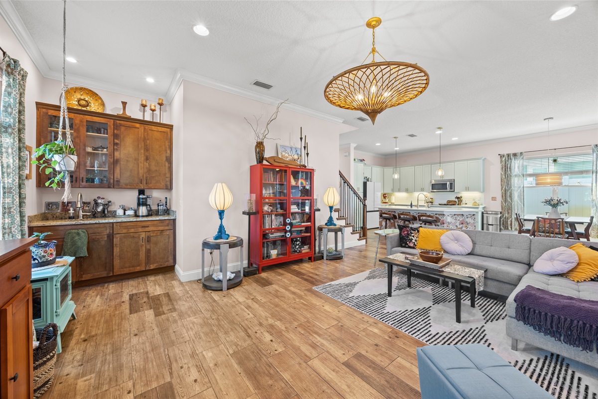Spacious open‑concept living area with modern kitchen and dining space in Jacksonville Beach vacation home.