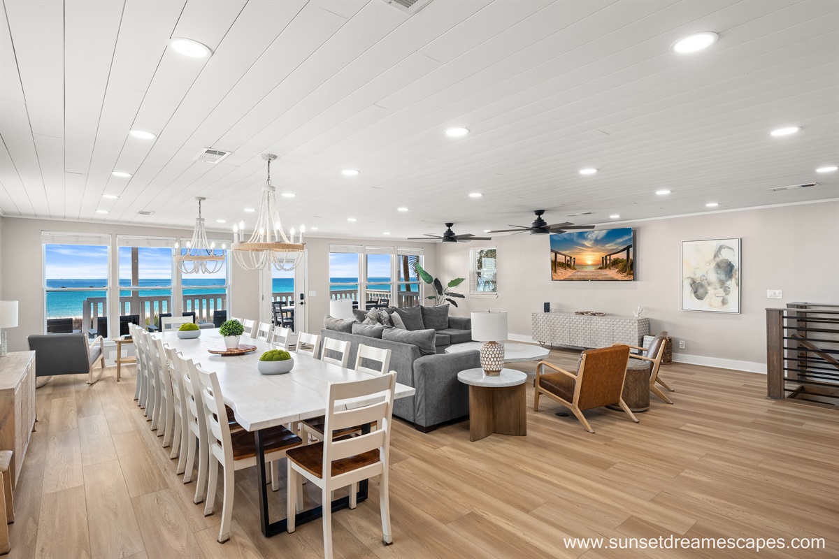 The two end-to-end dining room tables accommodate up to 16 guests together for meals while the open concept make it perfect for the family to gather.