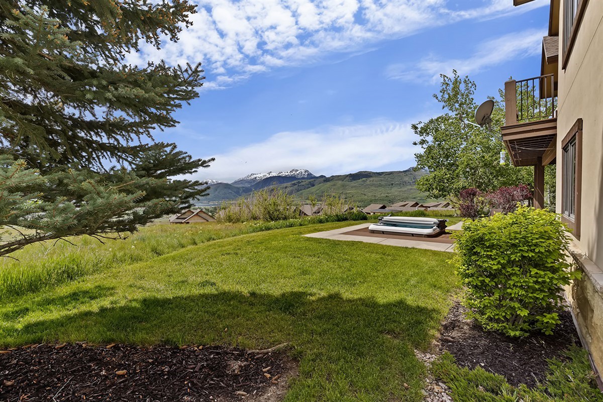 Soak in the hot tub while the mountains stretch out before you
