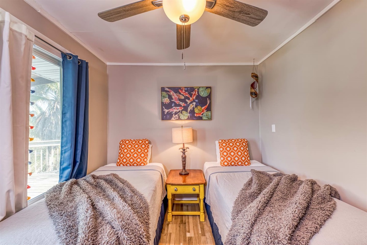 Twin Bedroom: Bright and airy retreat with charming decor and cozy wraps for ultimate relaxation!